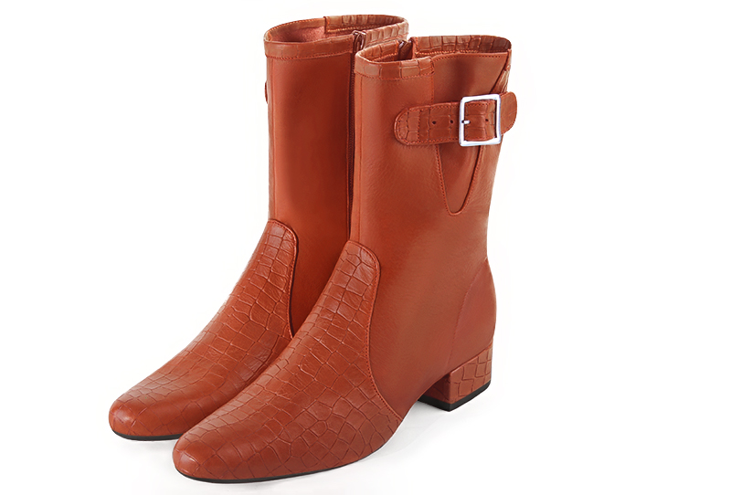 Terracotta orange women's ankle boots with buckles on the sides. Round toe. Low block heels. Front view - Florence KOOIJMAN